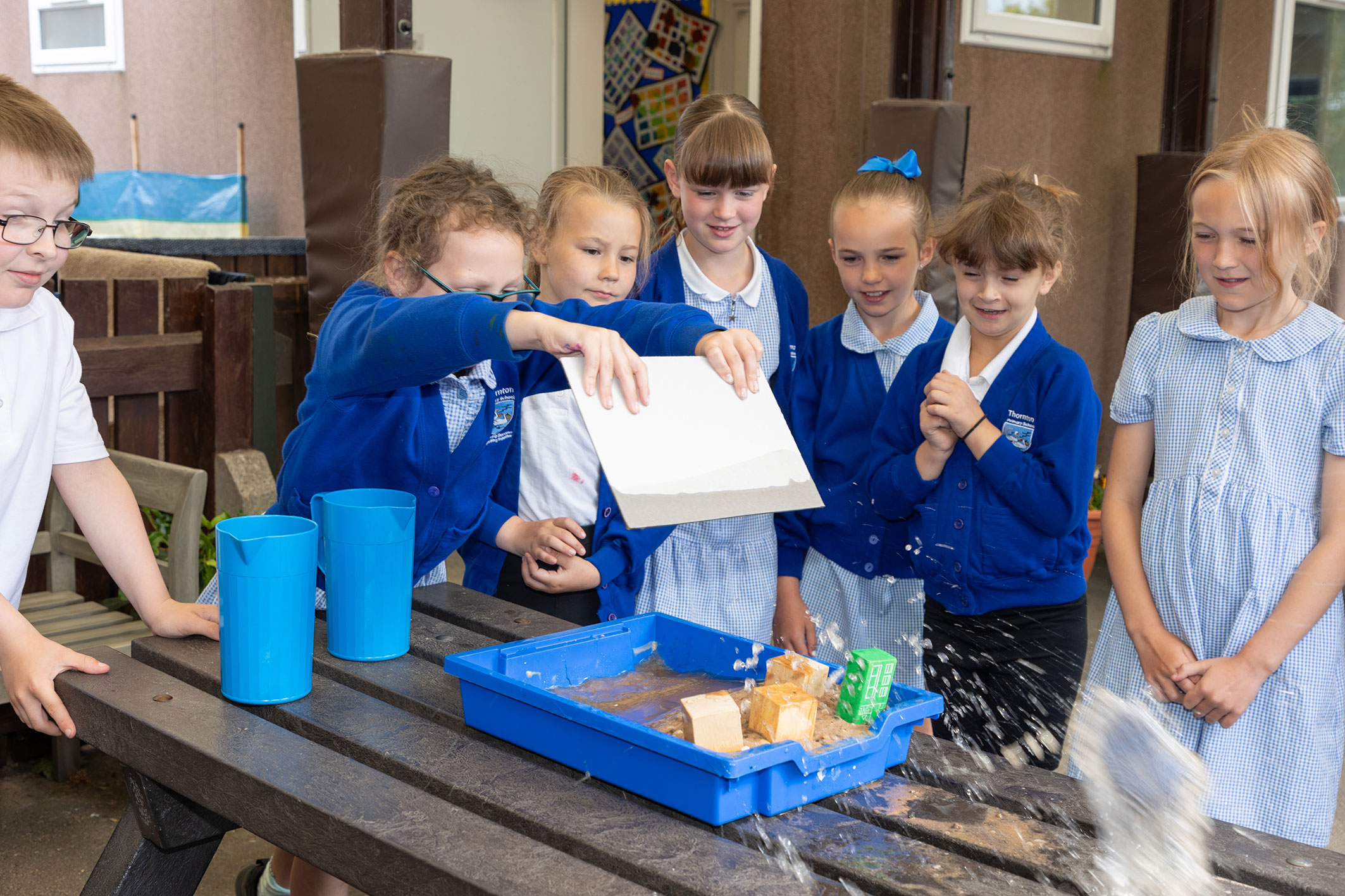 Children learning about the tide