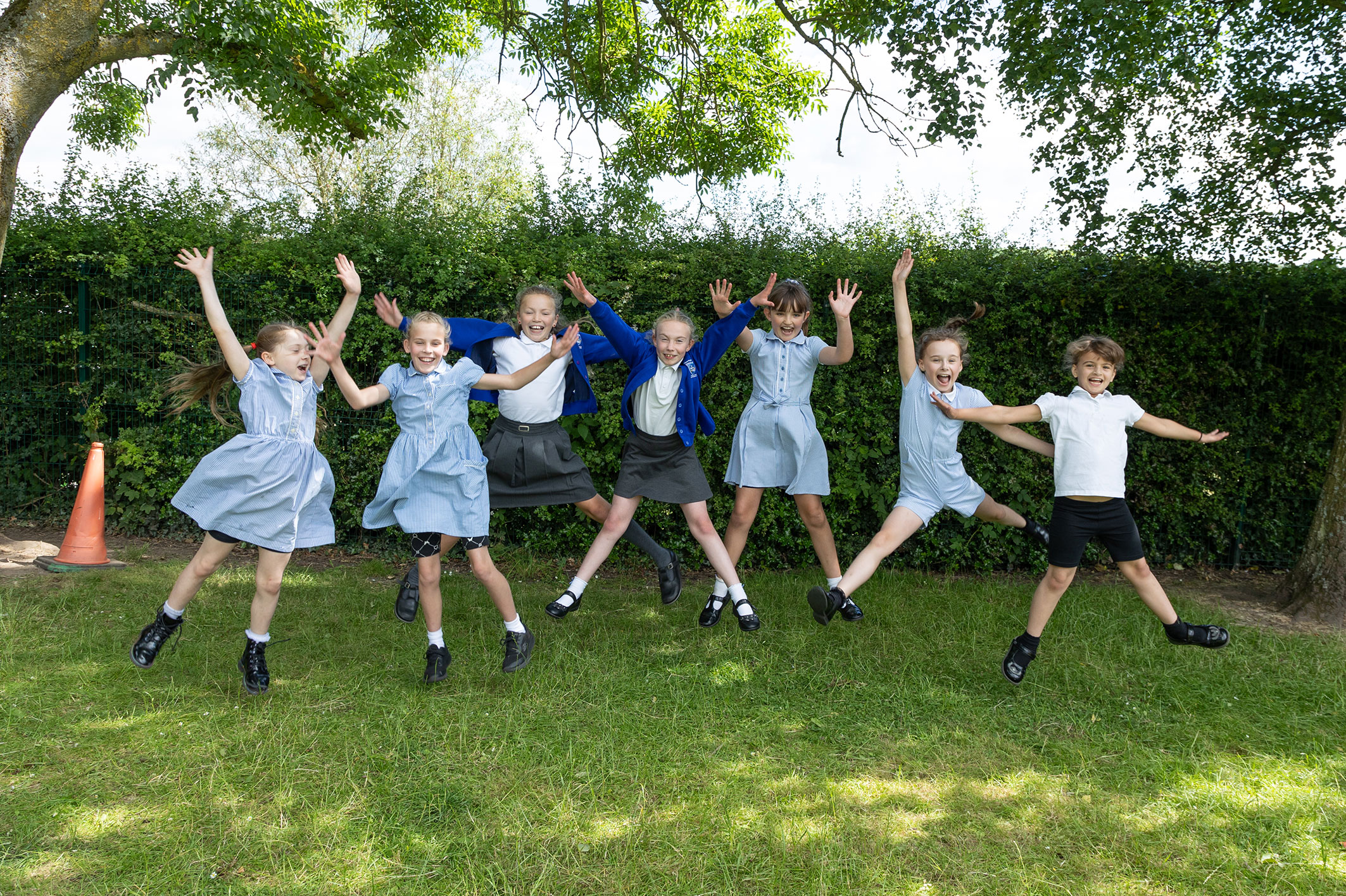 Children jumping on the air in the school uniform at Thornton